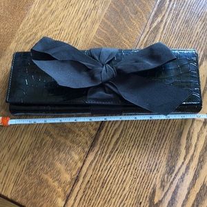 Adorable black clutch fits iPhone plus